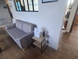 an image of a living room with a couch and coffee table