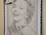 a black and white photo of a woman on a shelf