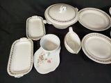 a lot of plates and cups on a black table