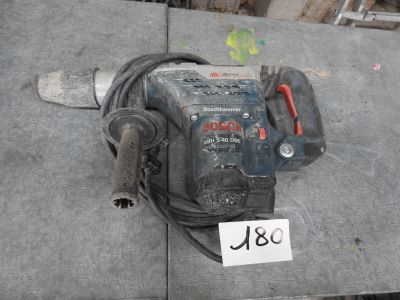 a drill on a table with a price tag on it
