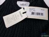 the label on the sweater is attached to the tag of the sweater
