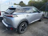 the rear end of a silver toyota c - hr parked in a parking lot