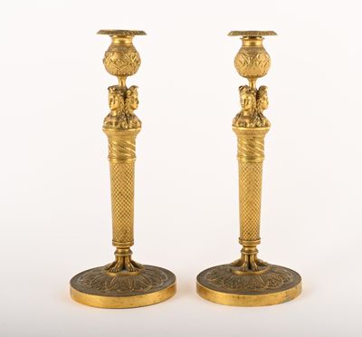 pair of antique brass candlesticks with lion heads