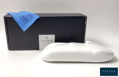 a close up of a soap dish in front of a box