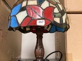 a lamp that is sitting on a table next to a box