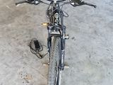 a bicycle that is parked in a garage