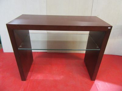 a wooden table with glass shelves on it on a red floor