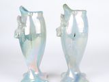 two vases that are sitting next to each other on a table