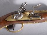 a close up of a gun that is on a table