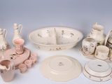 many different types of porcelain dishes and bowls on the table