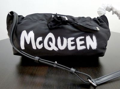 a black bag with white writing on it on a table