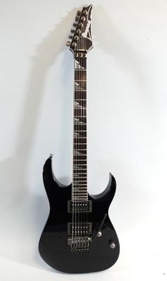 an electric guitar sitting on a stand against a white wall