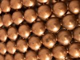 a close up of a large metal ball sculpture
