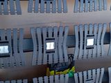 a picture of a wall mounted rack with a bunch of cell phones on it