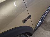 a close up of a car door with a sticker on it