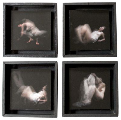 four framed photographs of a woman laying on her stomach and a man laying on the ground