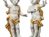 pair of white and gold statues of cherenshes on marble bases