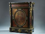 an image of a black and gold painted cabinet