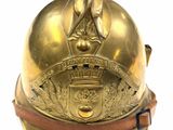 a gold helmet with a crown on top of it
