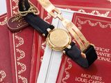 a watch that is laying on a stack of books