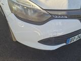 a white car that is parked in the parking lot