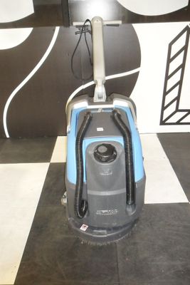 an image of a vacuum cleaner on a black and white checkered floor