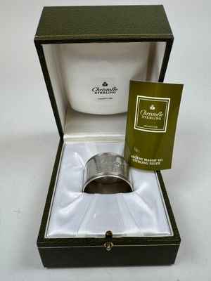 a box with a ring inside of it on a table