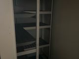 an image of a closet with shelves and shelves in it