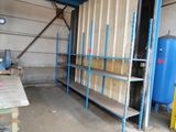 a room with shelves and a blue tank in it