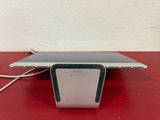 a laptop computer sitting on top of a red table