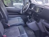 a view of the inside of a car from the driver ' s seat