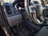 dashboard of a car with a steering wheel and dashboard controls