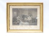 une vieille photo d'un groupe de personnes assises autour d'une table