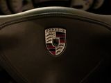 a close up of the emblem on a car ' s steering wheel