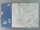 an open book with a drawing on it sitting on top of a table