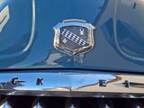 a close up of a car ' s grille with a star on it