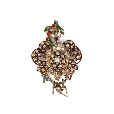 an image of a close up of a brooch with a bird on it