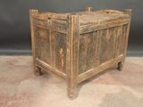 a small wooden box with a door on top of it