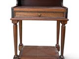 an old wooden desk with a drawer on top of it