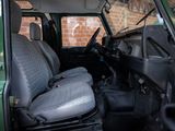 an image of a green van with two seats and a steering wheel