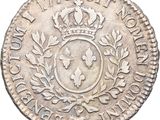 a silver coin with a crown on top of it