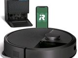 an image of a robotic vacuum cleaner with a remote control