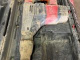 a tool box with a hammer and other tools inside of it