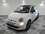 la photo d'une petite voiture blanche garée dans un garage