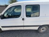 a picture of a white van parked in a parking lot