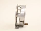 a metal object that is sitting on a white surface