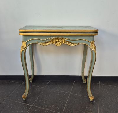 an image of a small table with a gold and blue top