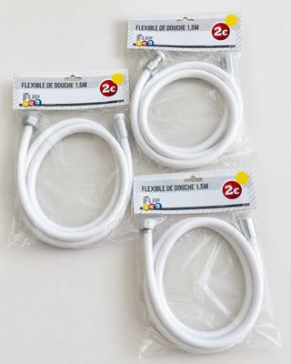 four pieces of white flexible cable in plastic bags on a white surface