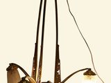 a chandelier with three lights hanging from the ceiling