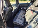 the back seat of a car with a seat cushion in it